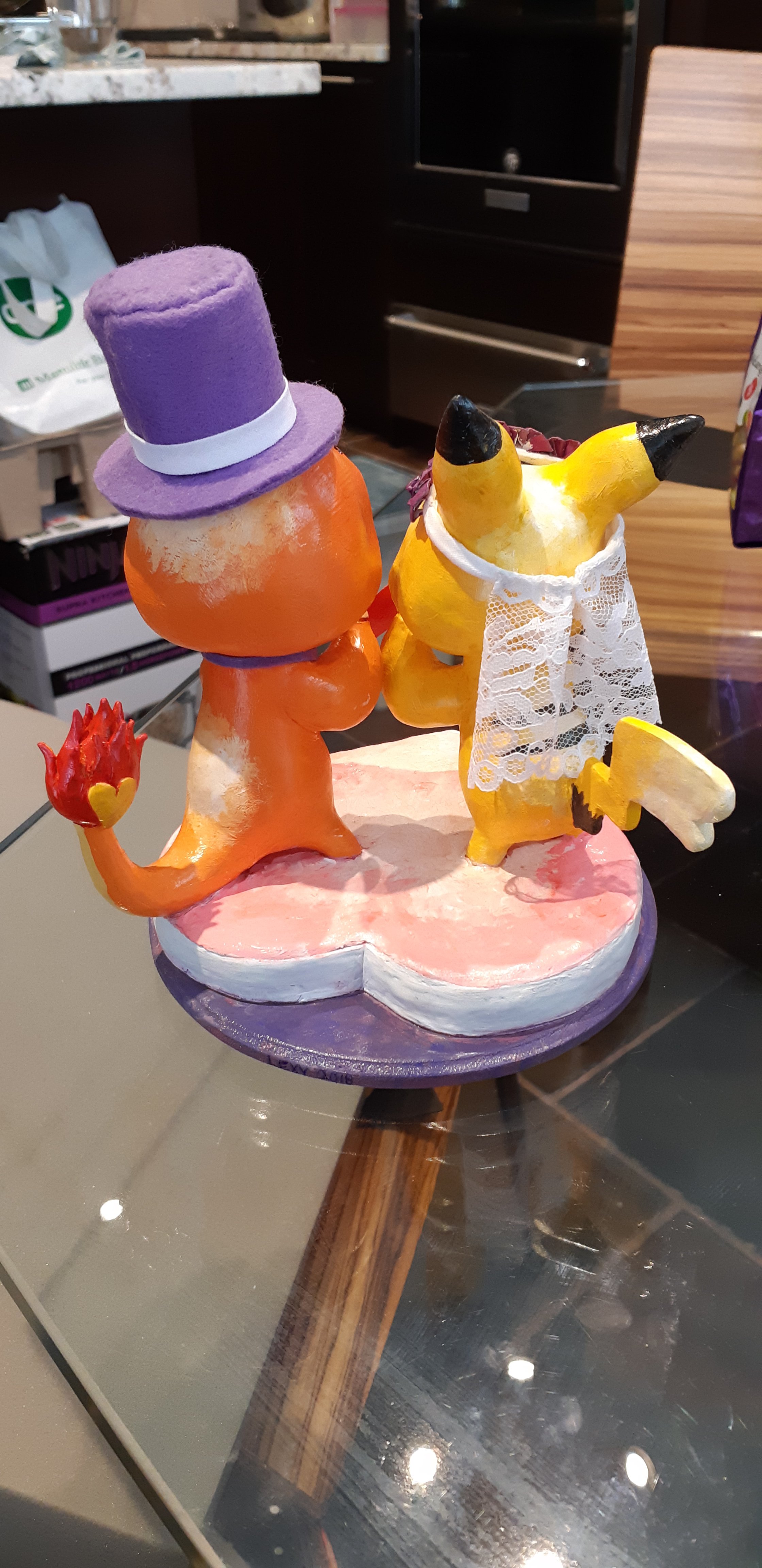 This is the completed sculpture, showing the back. You can see the pikachu and charmander tails, as well as the veil and top hat.