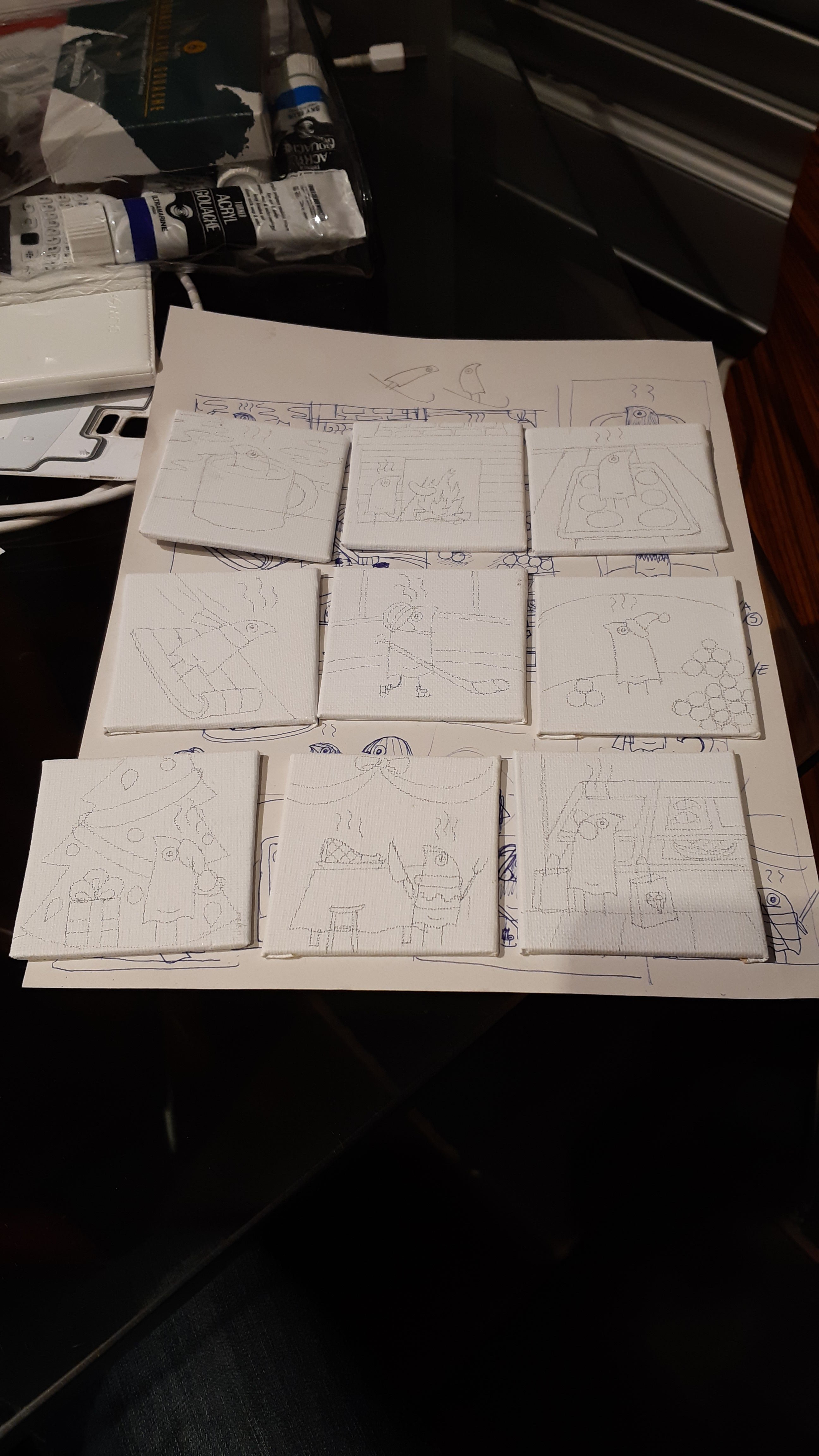 Nine mini canvases with sketches of the painted scenes on them.