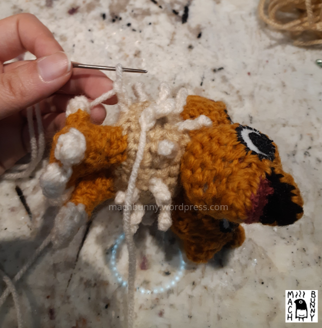 Chiks the Beta Pokemon amigurumi, W.I.P. view of making a new fluff piece, using the knitter's needle.