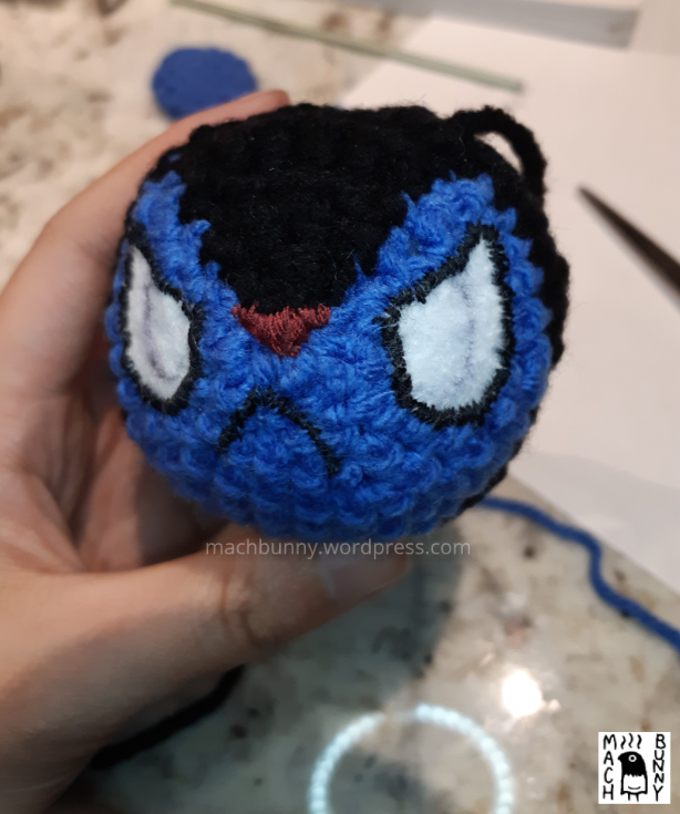 Amigurumi Luxio, with felt eyes, nose and mouth stitched into place