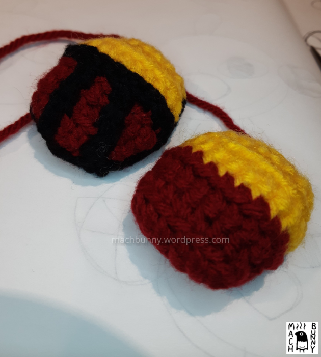 Top side of amigurumi natu, with and without stripes