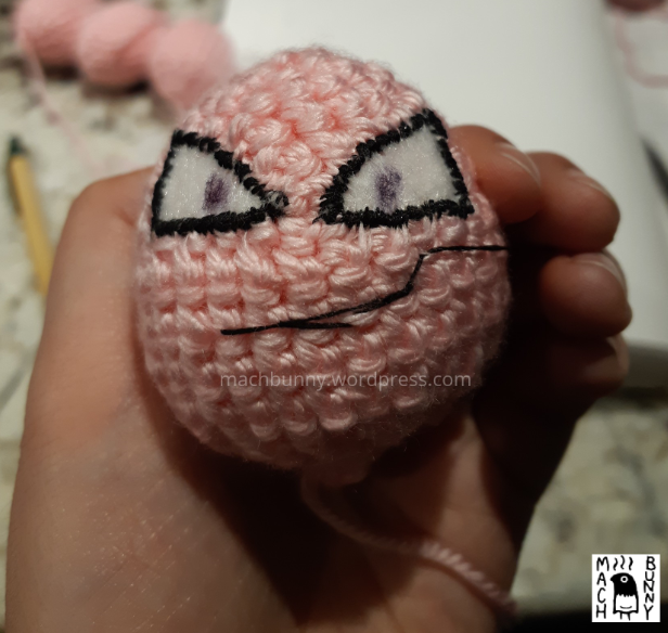Amigurumi Exeggcute, front view of main egg with mouth being roughly stitched on