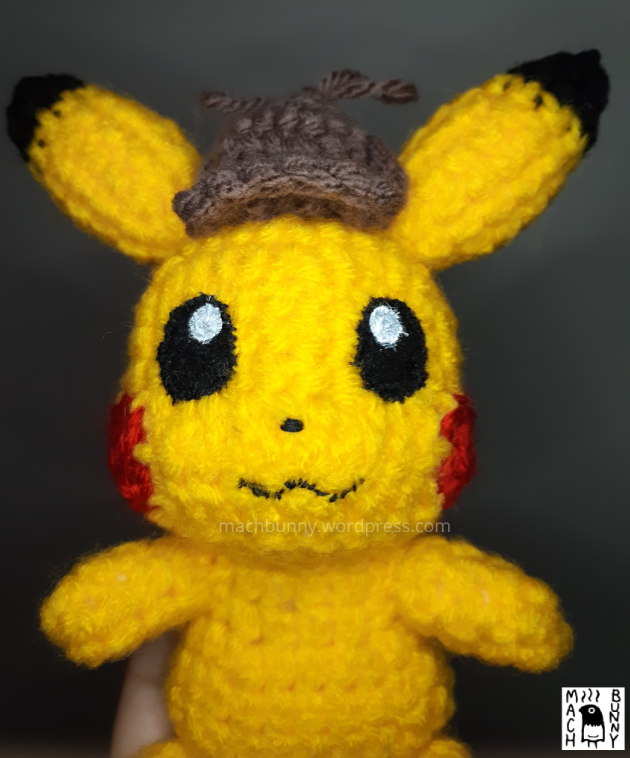 Amigurumi Detective Pikachu, front view close up