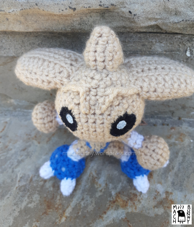Hitmontop amigurumi, front view and top down view