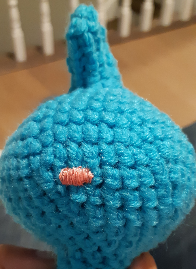 Amigurumi Dewott, front view of nose stitched onto head