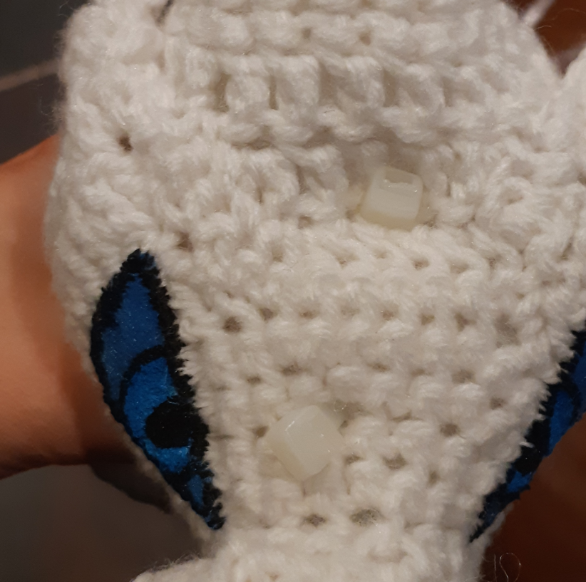 Amigurumi Reshiram, front view of zip ties fastened into the head