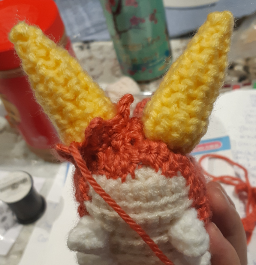 Amigurumi Wurmple, butt view showing partially completed tail spike details