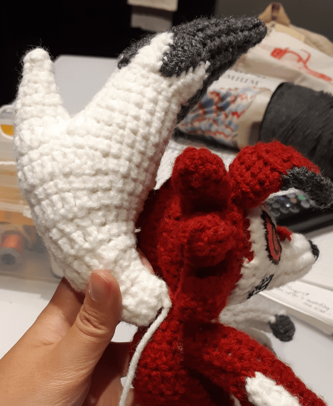 Amigurumi Lycanroc Midnight form, showing front mane piece attached onto the back of the head