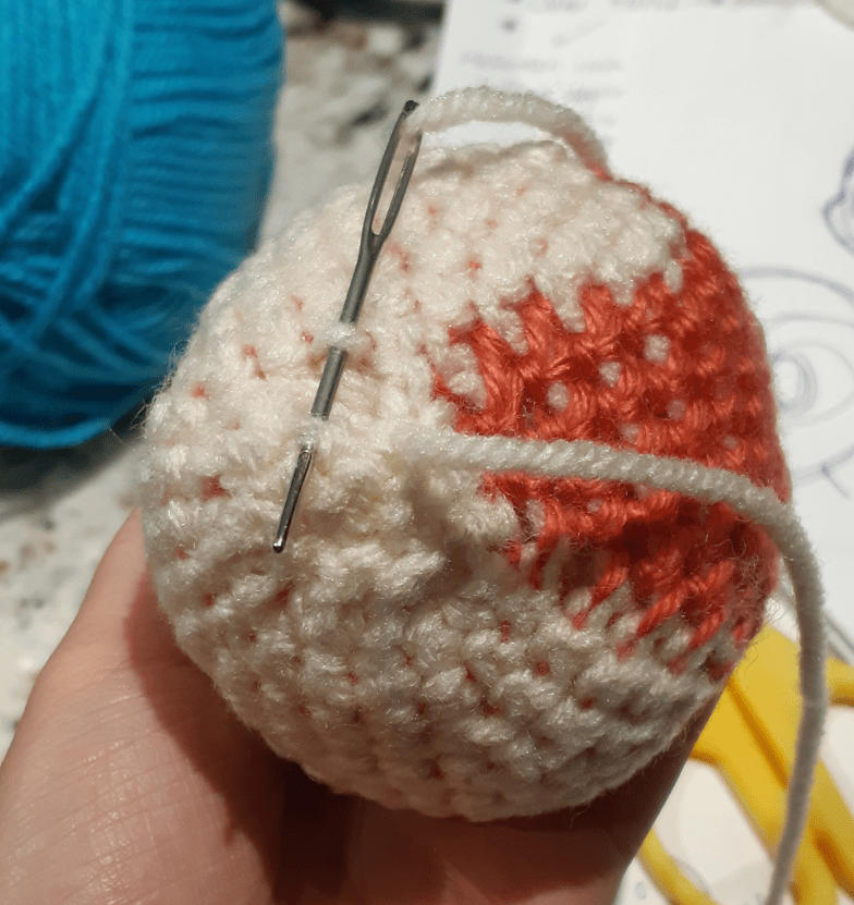 Amigurumi Sylveon, front view of head base being stitched together