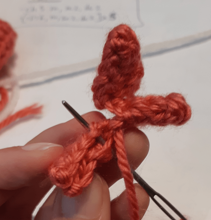 Amigurumi Sylveon, tuft piece being stitched together