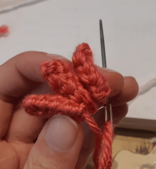 Amigurumi Sylveon, tuft piece being stitched into position