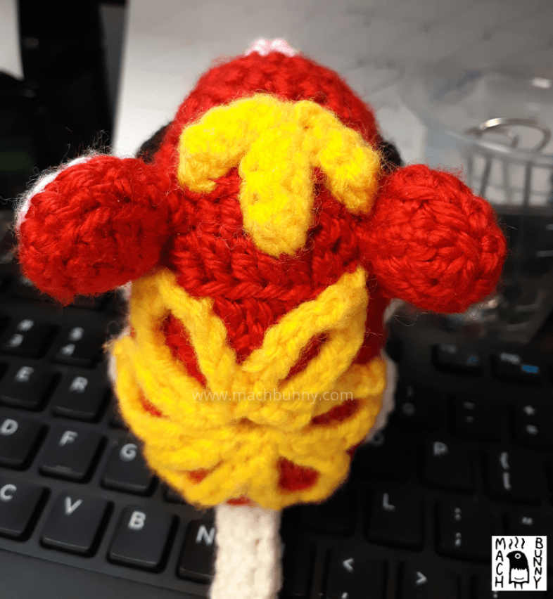 Amigurumi zodiac rat, back view from top down