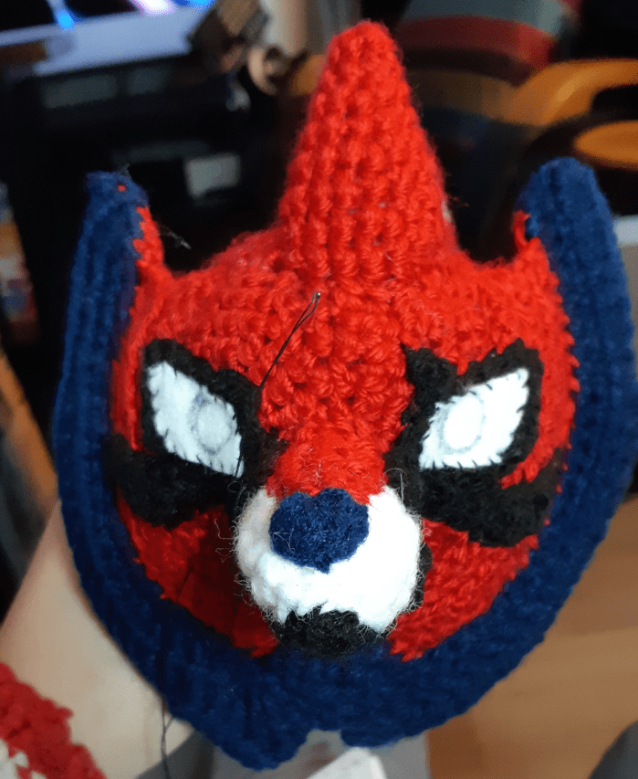 Zamazenta face, with eye and muzzle details and felt eyes stitched on