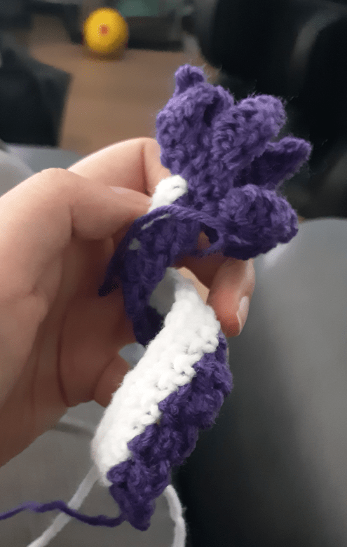 Amigurumi Gatomon, showing tail coiled before stitching together