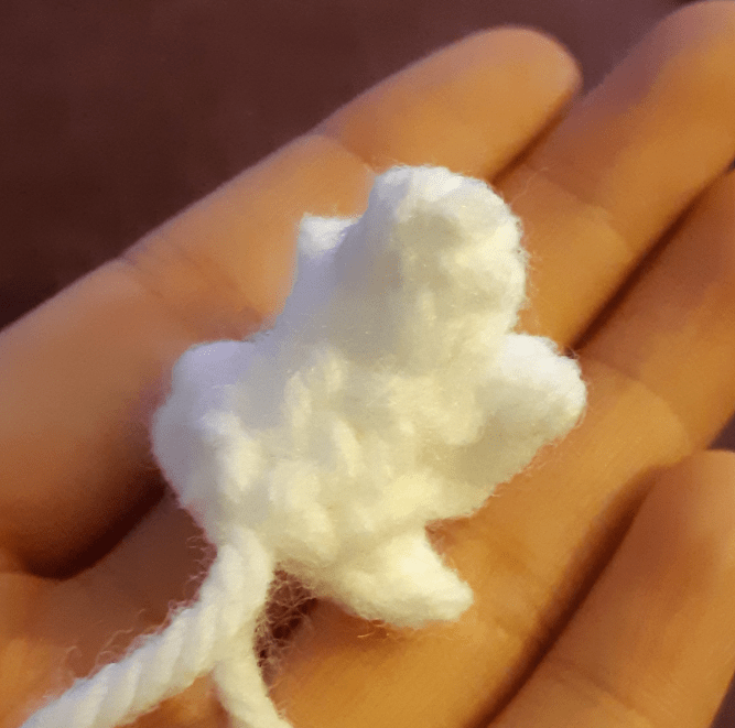 Swan Kwami amigurumi, showing tail piece stitched together